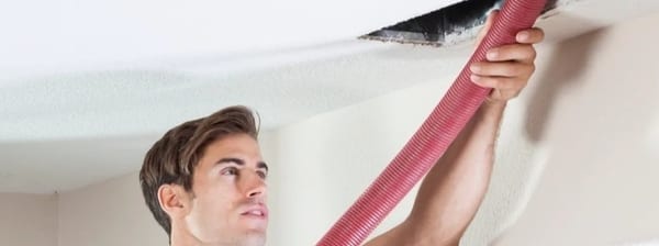 Professional air duct cleaning service technician